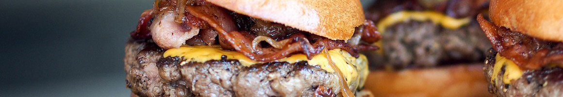 Eating American (Traditional) Burger Hot Dog at JCI- James Coney Island restaurant in Houston, TX.